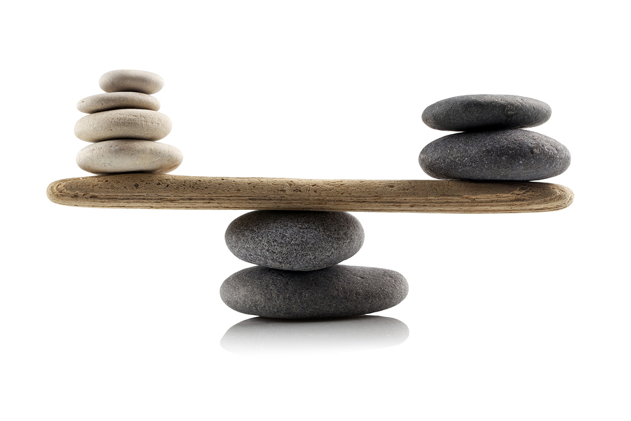 balancing stones on white background